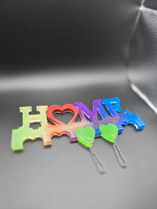 Family key chain holder with 5 heart chains.